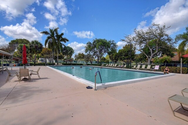 8449 Springlake Dr, Boca Raton, FL 33496 - pool with fence and a patio area