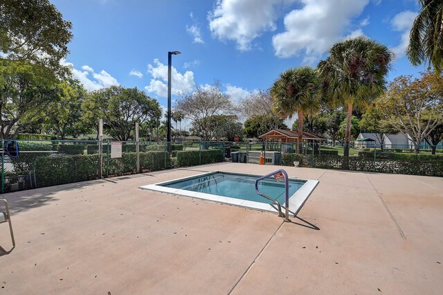 8449 Springlake Dr, Boca Raton, FL 33496 - view of swimming pool featuring fence