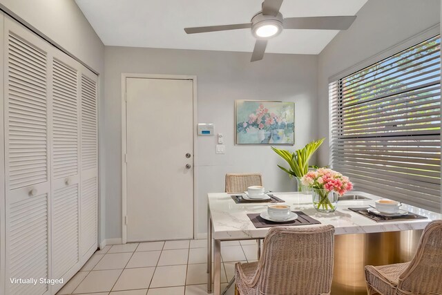 8449 Springlake Dr, Boca Raton, FL 33496 - unfurnished room featuring baseboards, high vaulted ceiling, light tile patterned flooring, and a chandelier