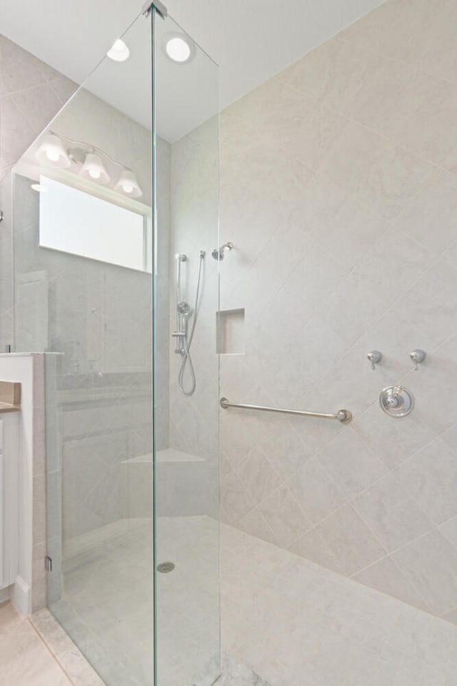 full bathroom featuring a walk in shower