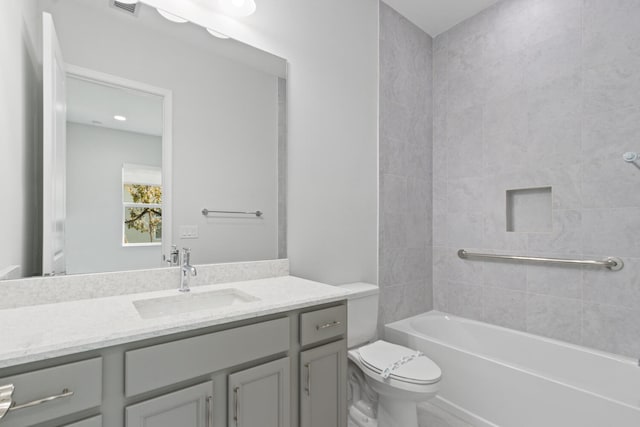 full bath featuring toilet, visible vents, bathing tub / shower combination, and vanity
