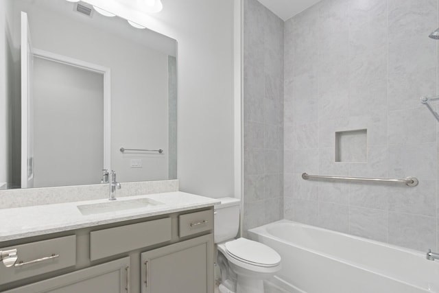 bathroom with visible vents, shower / washtub combination, toilet, and vanity