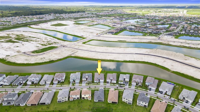 bird's eye view with a water view and a residential view