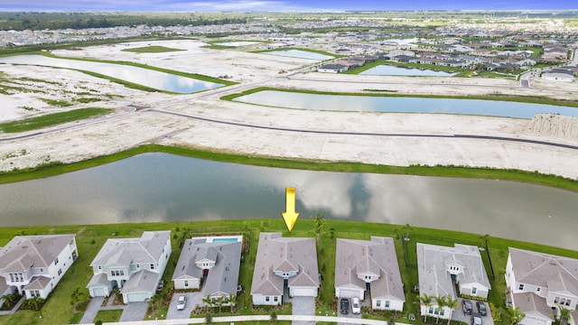 aerial view featuring a water view and a residential view