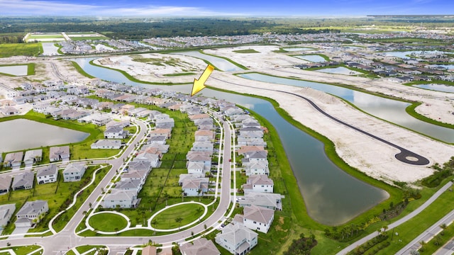 aerial view with a water view and a residential view