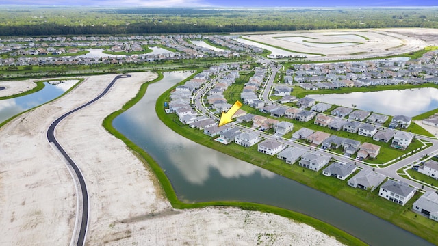 bird's eye view with a residential view and a water view