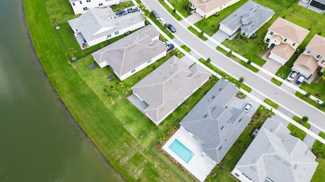 birds eye view of property with a residential view and a water view
