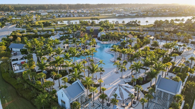 drone / aerial view with a water view and a residential view