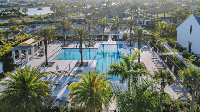 community pool featuring a water view and a patio area