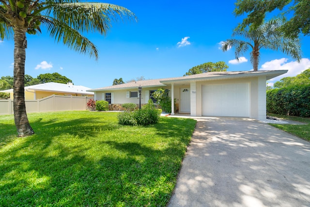 966 37th Ave, Vero Beach, FL 32960 - single story home featuring a garage, stucco siding, fence, a front lawn, and driveway