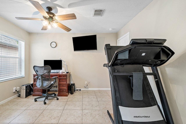 tiled office with baseboards, ceiling fan, and visible vents