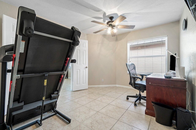 office with baseboards, a textured ceiling, ceiling fan, and light tile patterned floors
