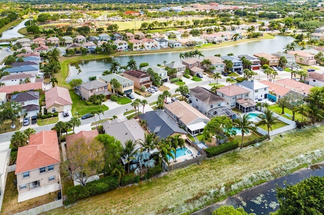bird's eye view with a water view and a residential view