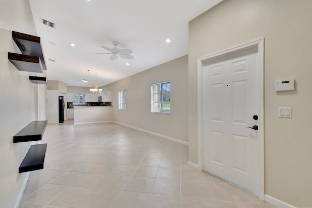 entrance foyer featuring visible vents, baseboards, recessed lighting, ceiling fan with notable chandelier, and light tile patterned floors