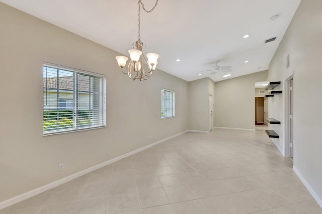 spare room with ceiling fan with notable chandelier, recessed lighting, baseboards, light tile patterned floors, and vaulted ceiling