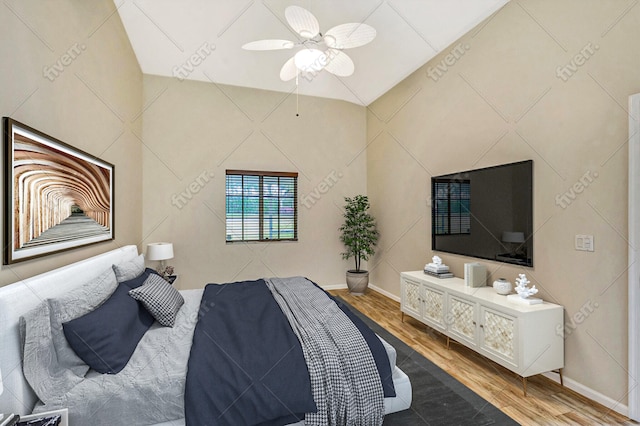 bedroom featuring baseboards, a ceiling fan, and wood finished floors