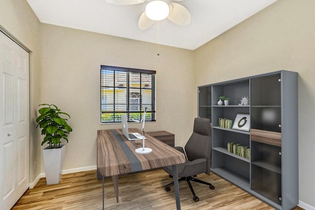 office with baseboards, a ceiling fan, and wood finished floors