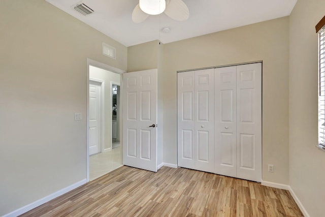 unfurnished bedroom with baseboards, visible vents, and light wood-style flooring