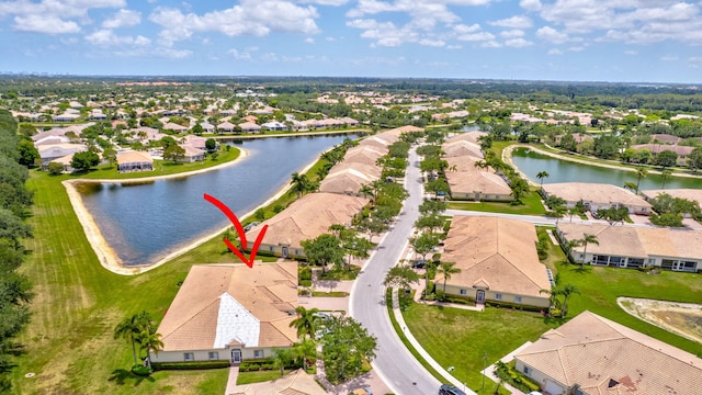 aerial view featuring a water view and a residential view