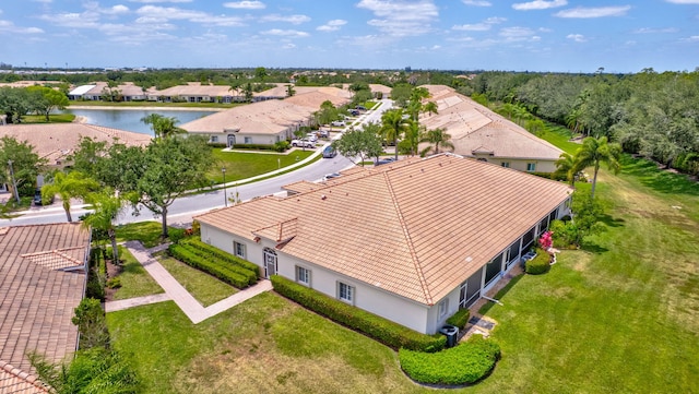 bird's eye view featuring a water view and a residential view