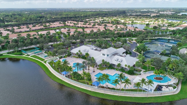 drone / aerial view with a water view and a residential view