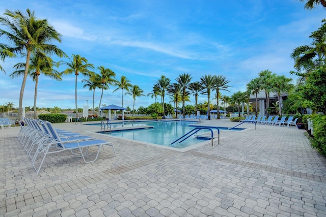 community pool with a patio area