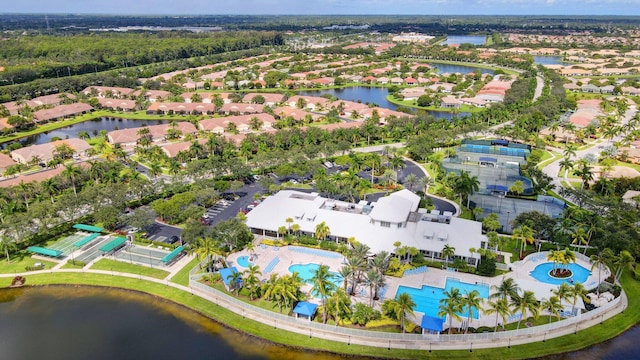 birds eye view of property featuring a water view and a residential view