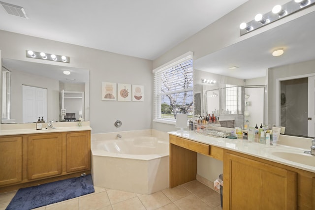 full bath with a garden tub, visible vents, tile patterned flooring, a stall shower, and a sink