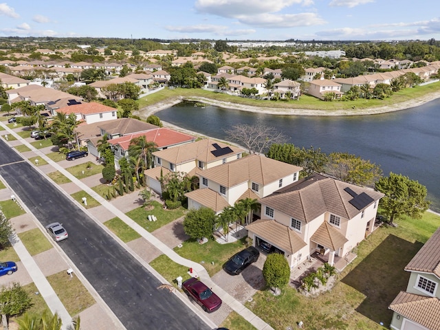 aerial view featuring a water view and a residential view