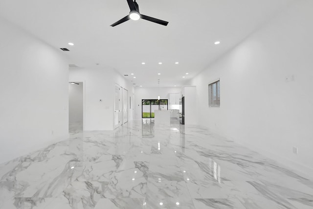 unfurnished room featuring ceiling fan, recessed lighting, visible vents, and marble finish floor
