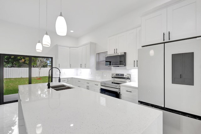 kitchen featuring a sink, appliances with stainless steel finishes, white cabinets, and tasteful backsplash