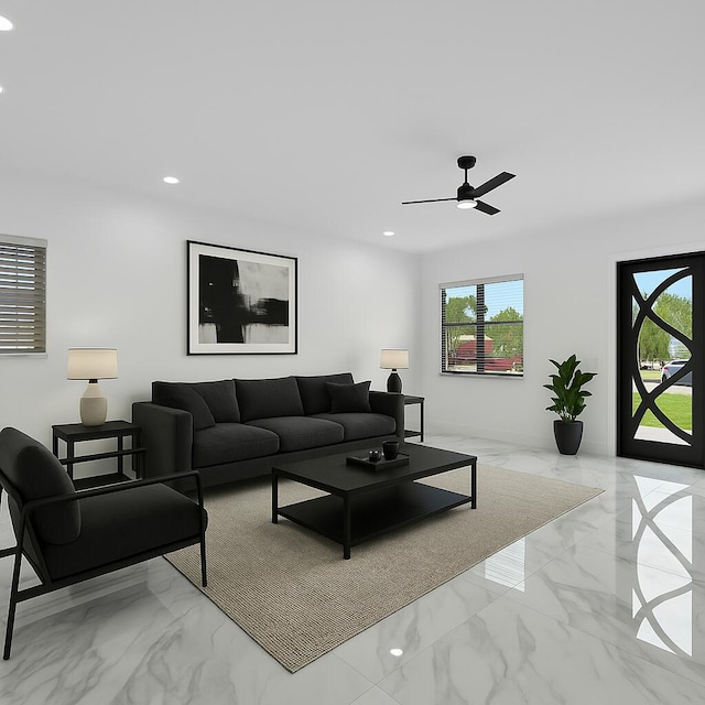 living area with recessed lighting, a ceiling fan, and marble finish floor