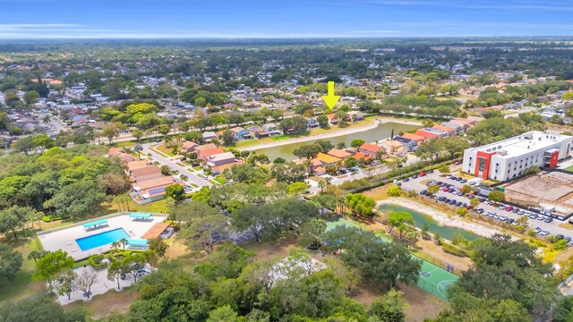 birds eye view of property with a water view