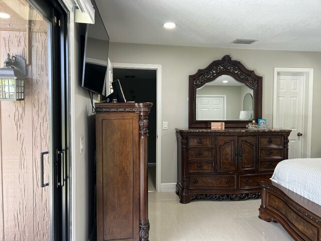 bedroom featuring light tile patterned floors, recessed lighting, and visible vents