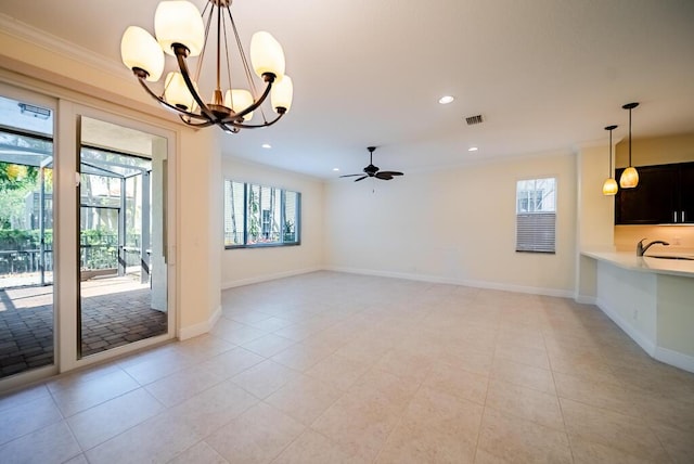 unfurnished dining area with a chandelier, a ceiling fan, a sink, recessed lighting, and crown molding