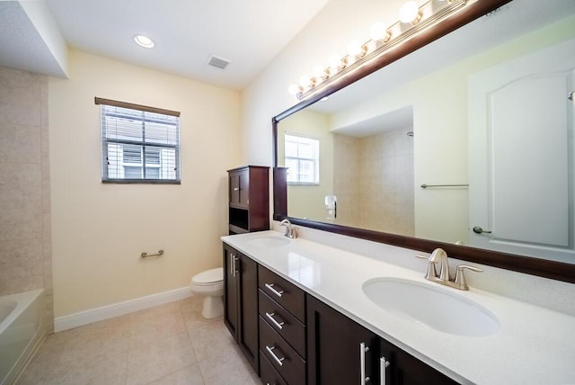 bathroom with toilet, baseboards, tile patterned flooring, double vanity, and recessed lighting
