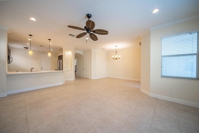 empty room with ceiling fan, a chandelier, arched walkways, recessed lighting, and ornamental molding