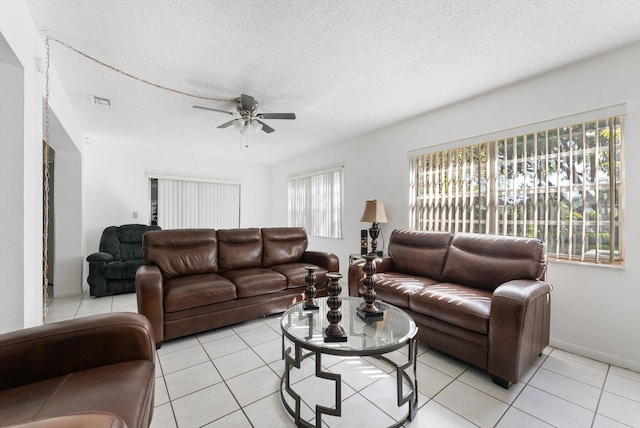 6292 Silver Moon Ln, Greenacres, FL 33463 - living area featuring a ceiling fan, a textured ceiling, and light tile patterned flooring
