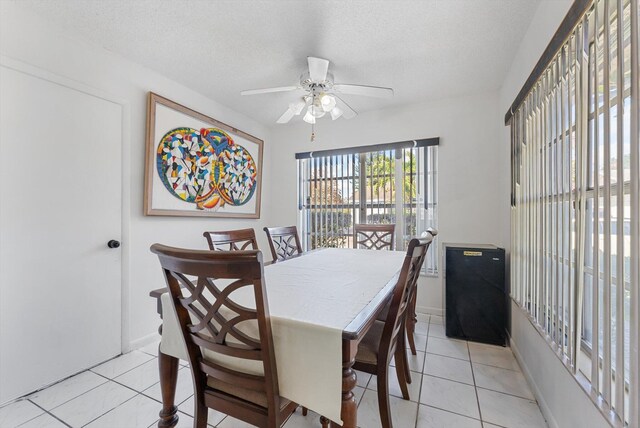 6292 Silver Moon Ln, Greenacres, FL 33463 - dining space featuring baseboards, a textured ceiling, ceiling fan, and light tile patterned flooring