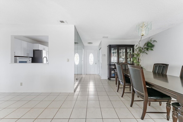 6292 Silver Moon Ln, Greenacres, FL 33463 - dining space with light tile patterned floors, a chandelier, and visible vents