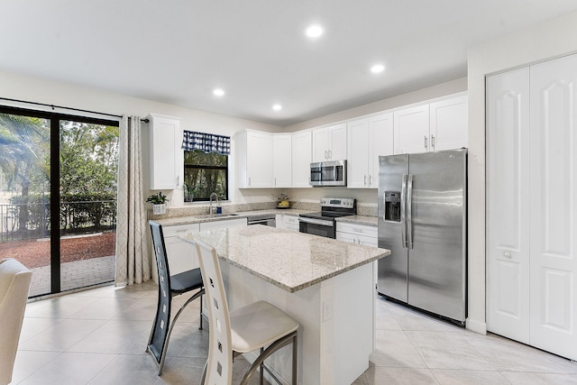 12968 Anthorne Ln, Boynton Beach, FL 33436 - kitchen featuring a center island, a sink, recessed lighting, and stainless steel appliances