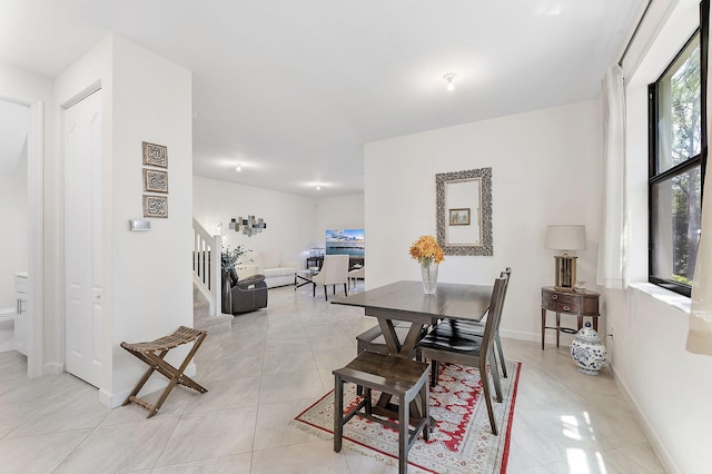 12968 Anthorne Ln, Boynton Beach, FL 33436 - dining space featuring baseboards, stairs, and light tile patterned floors