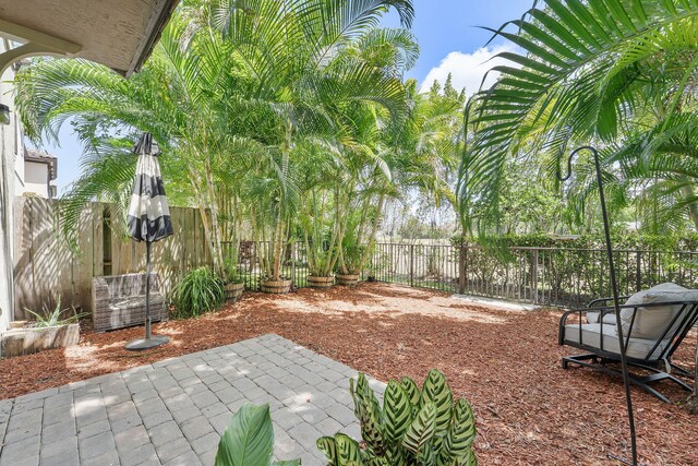 12968 Anthorne Ln, Boynton Beach, FL 33436 - view of yard with a fenced backyard and a patio area