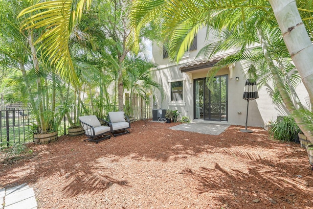 12968 Anthorne Ln, Boynton Beach, FL 33436 - view of patio / terrace featuring central AC unit and fence
