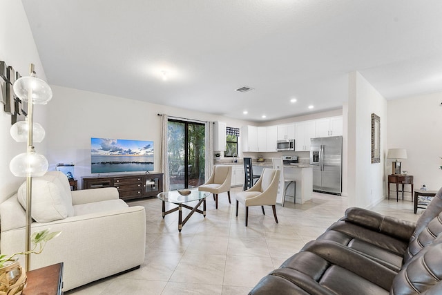 12968 Anthorne Ln, Boynton Beach, FL 33436 - living room featuring light tile patterned floors, recessed lighting, and visible vents