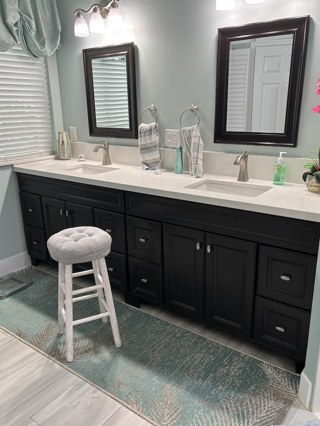 3237 El Camino Real, West Palm Beach, FL 33409 - full bathroom featuring double vanity and a sink