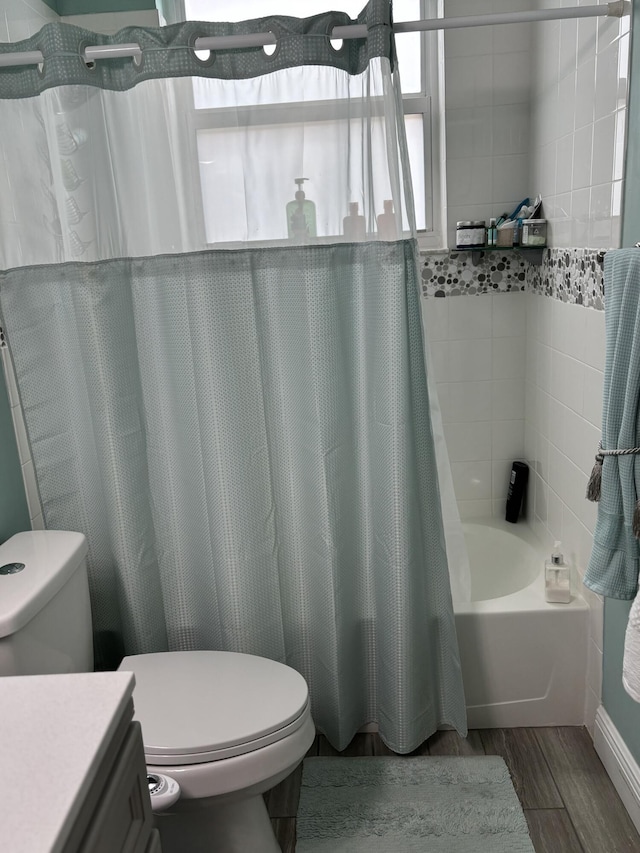 3237 El Camino Real, West Palm Beach, FL 33409 - bathroom featuring toilet, wood finished floors, shower / bath combo, and vanity