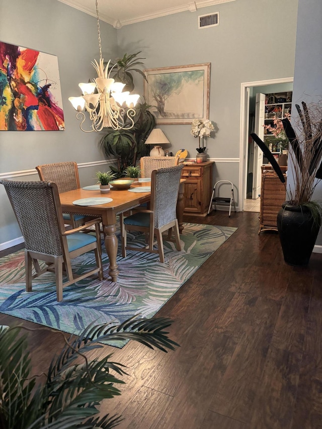 3237 El Camino Real, West Palm Beach, FL 33409 - dining space with visible vents, ornamental molding, an inviting chandelier, baseboards, and dark wood-type flooring