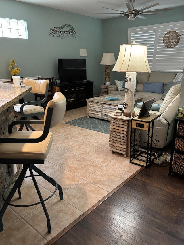 3237 El Camino Real, West Palm Beach, FL 33409 - living room featuring a ceiling fan and wood finished floors