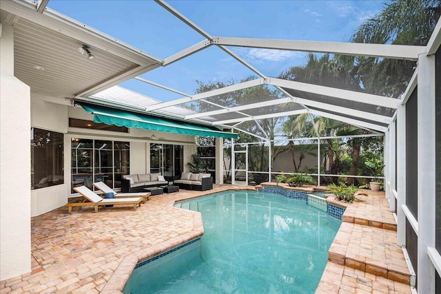 761 SW Lighthouse Dr, Palm City, FL 34990 - outdoor pool with glass enclosure, a patio area, and an outdoor hangout area
